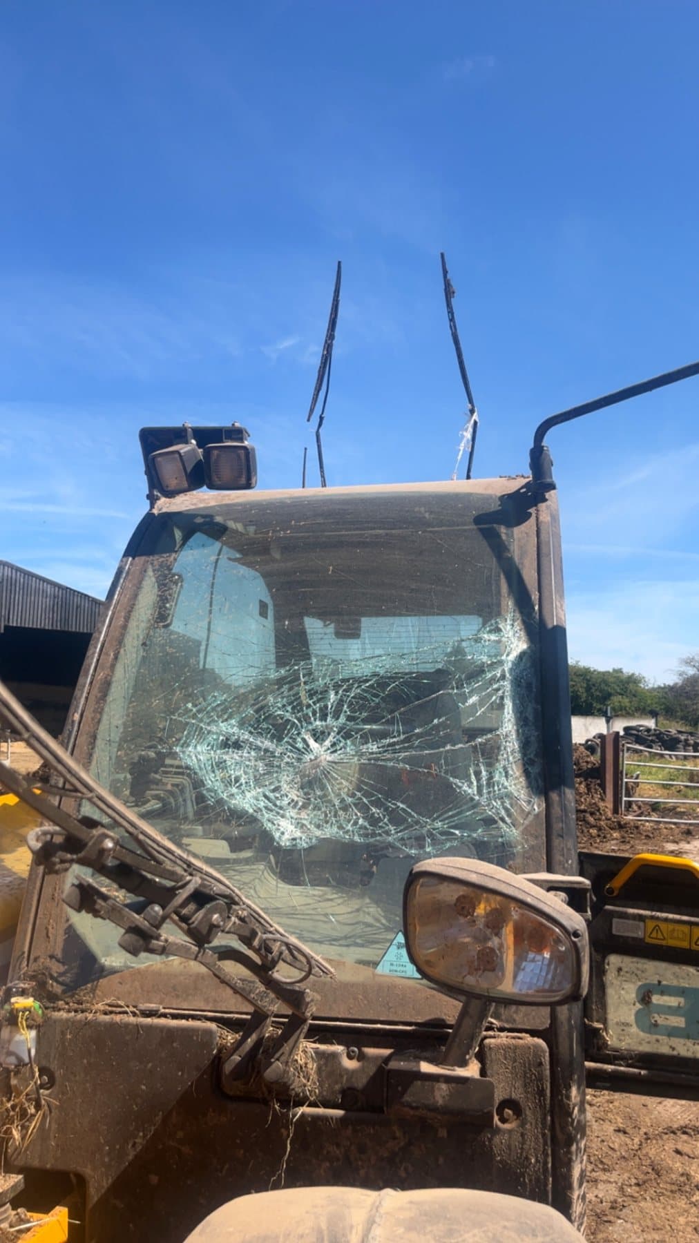 Damaged agricultural machine cab requiring repair