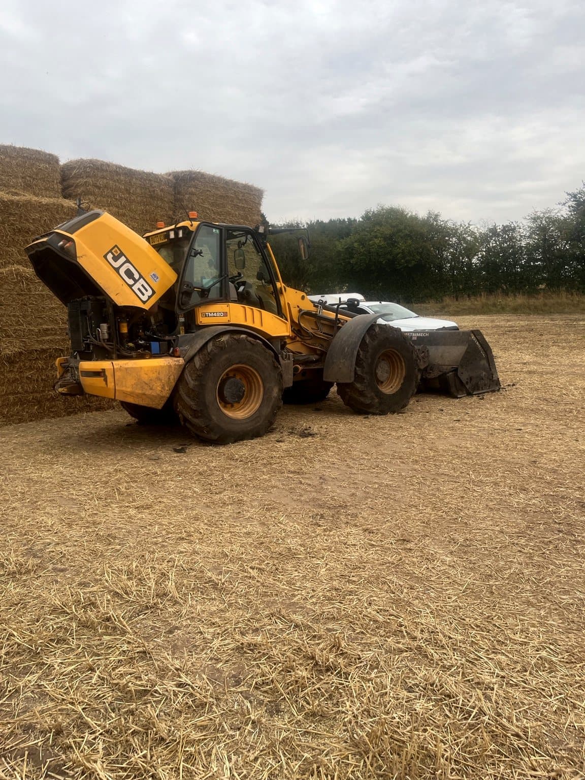 JCB telehandler undergoing field repair